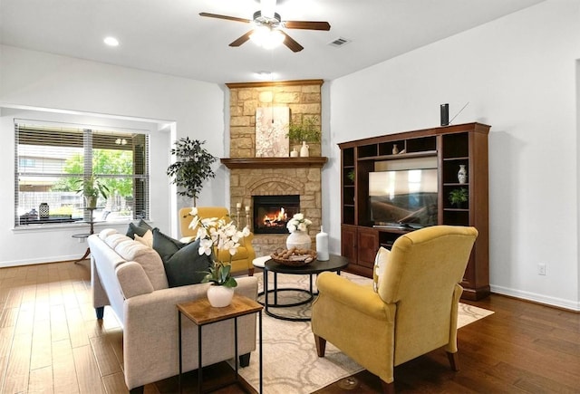 139 Merion Dr, Austin, TX 78737 - living room featuring ceiling fan, a stone fireplace, wood finished floors, and recessed lighting