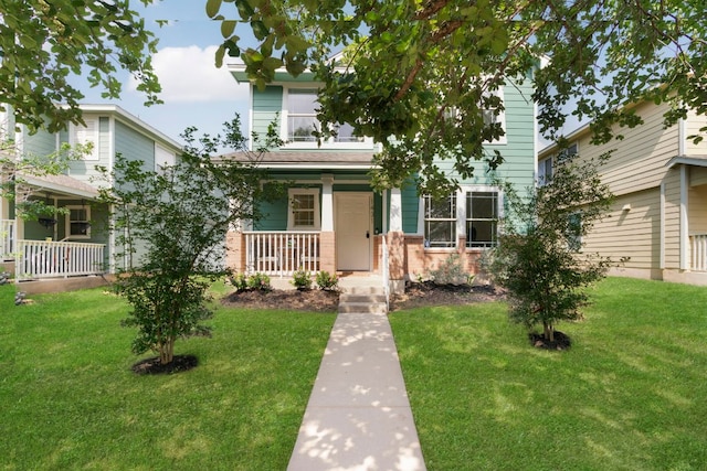 1431 Davis Mountain Loop, Cedar Park, TX 78613 - view of front of home with a porch, a front lawn, and brick siding