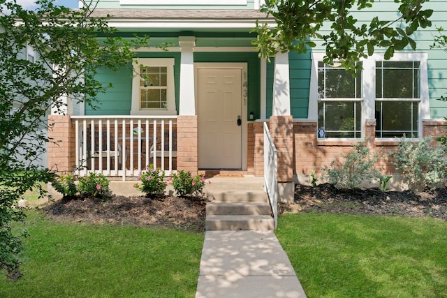 1431 Davis Mountain Loop, Cedar Park, TX 78613 - property entrance with brick siding, a porch, a yard, and roof with shingles