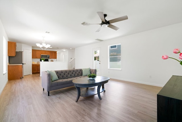 1431 Davis Mountain Loop, Cedar Park, TX 78613 - living room with a chandelier, light wood-style floors, and a ceiling fan