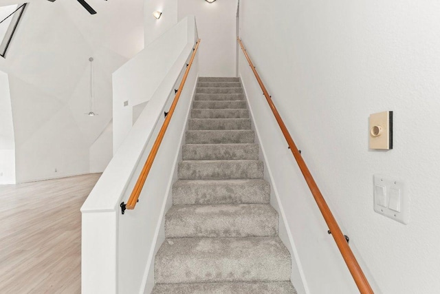 17226 Rocky Ridge Rd, Austin, TX 78734 - staircase with ceiling fan and wood finished floors