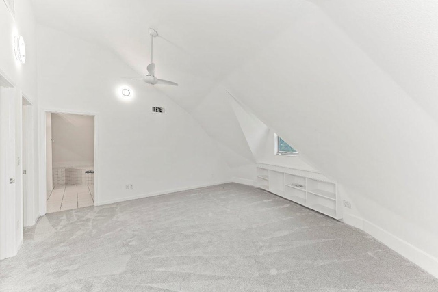 17226 Rocky Ridge Rd, Austin, TX 78734 - bonus room with vaulted ceiling, carpet floors, and ceiling fan