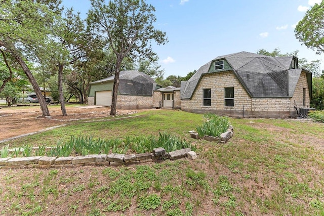 17226 Rocky Ridge Rd, Austin, TX 78734 - view of front of property with a front lawn, a shingled roof, and a gambrel roof
