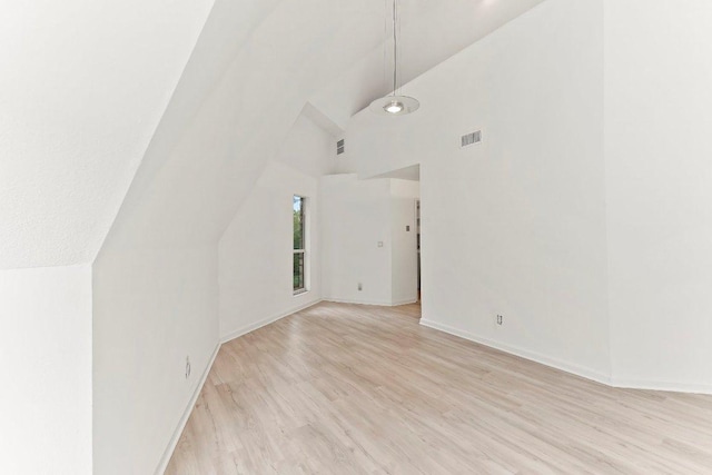 17226 Rocky Ridge Rd, Austin, TX 78734 - unfurnished living room featuring light wood-type flooring and high vaulted ceiling