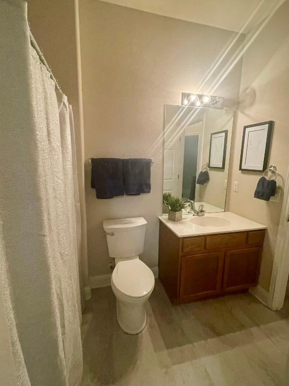 209 Crockett Loop, Georgetown, TX 78633 - bathroom with vanity and wood finished floors