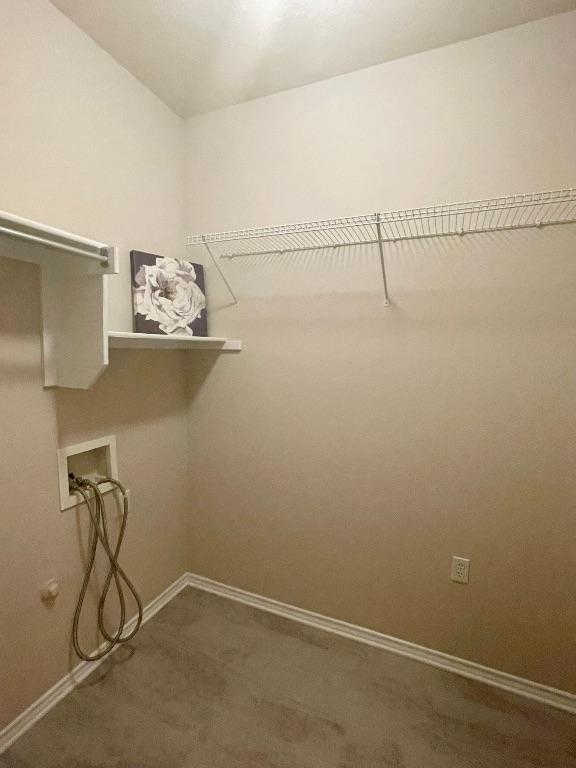 209 Crockett Loop, Georgetown, TX 78633 - spacious closet with dark colored carpet