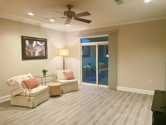 209 Crockett Loop, Georgetown, TX 78633 - sitting room featuring wood finished floors, a ceiling fan, recessed lighting, and crown molding