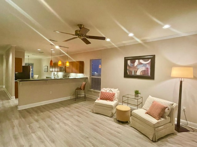 209 Crockett Loop, Georgetown, TX 78633 - living area with ornamental molding, light wood finished floors, a ceiling fan, and recessed lighting