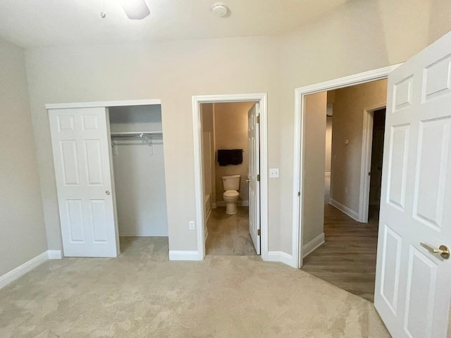 209 Crockett Loop, Georgetown, TX 78633 - unfurnished bedroom with a closet, light colored carpet, and ensuite bath