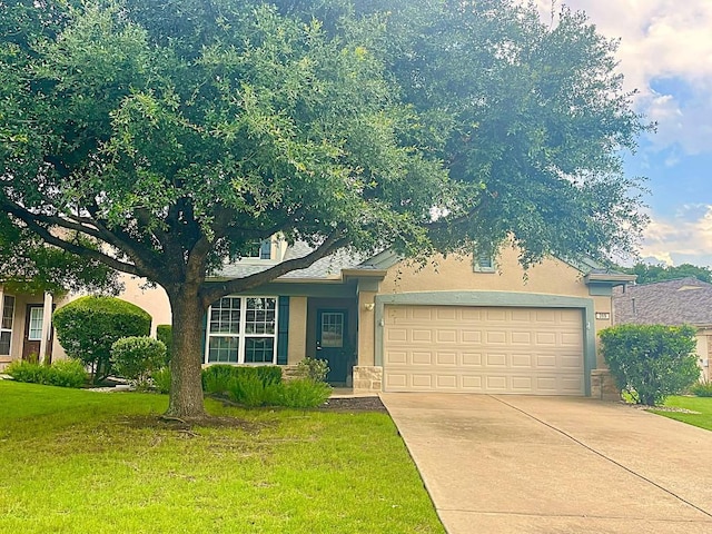 209 Crockett Loop, Georgetown, TX 78633 - view of front facade with an attached garage, concrete driveway, a front yard, and stucco siding