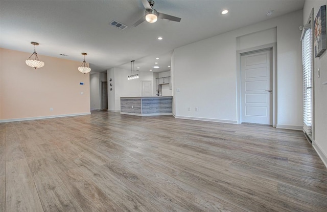 228 Tequilana Pass, Leander, TX 78641 - unfurnished living room with ceiling fan, light wood-type flooring, recessed lighting, and healthy amount of natural light
