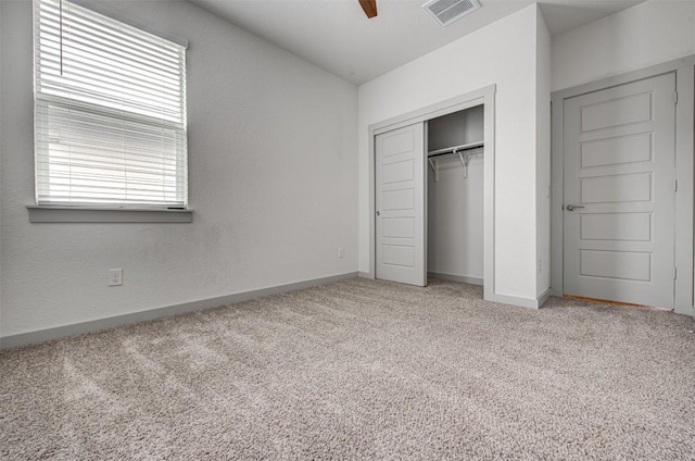228 Tequilana Pass, Leander, TX 78641 - unfurnished bedroom featuring light colored carpet, a closet, and a ceiling fan