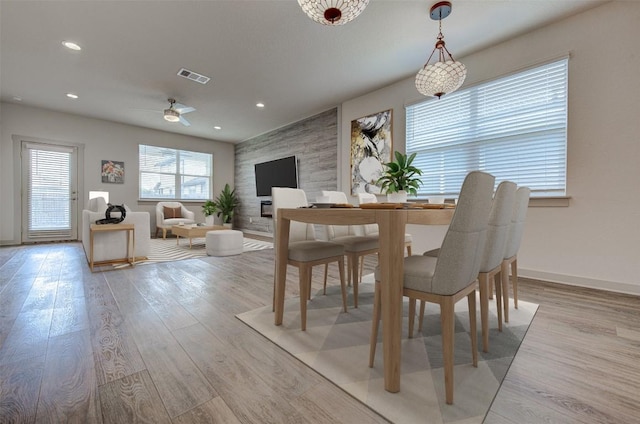 228 Tequilana Pass, Leander, TX 78641 - dining room featuring light wood finished floors, ceiling fan, and recessed lighting