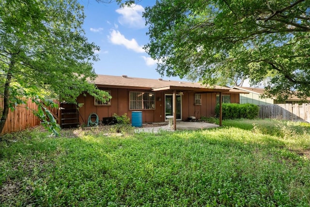 2329 Campden Dr, Austin, TX 78745 - rear view of property with a patio area and board and batten siding