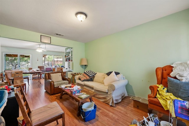 2329 Campden Dr, Austin, TX 78745 - living area with wood finished floors and ceiling fan
