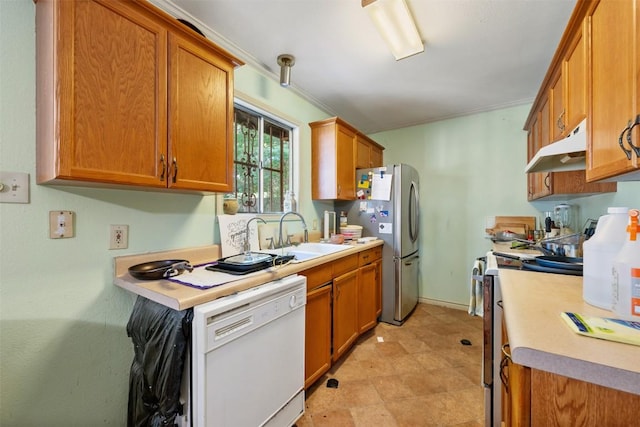 2329 Campden Dr, Austin, TX 78745 - kitchen with white dishwasher, under cabinet range hood, range, freestanding refrigerator, and light countertops