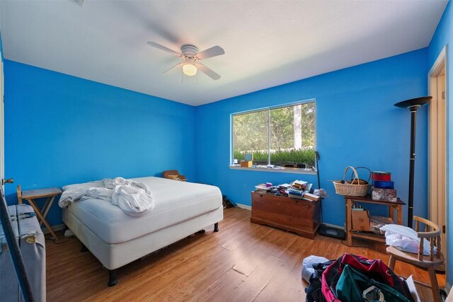 2329 Campden Dr, Austin, TX 78745 - bedroom with wood finished floors and ceiling fan
