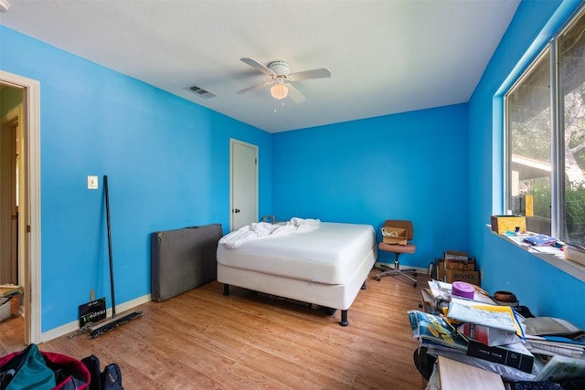 2329 Campden Dr, Austin, TX 78745 - bedroom featuring wood finished floors and ceiling fan