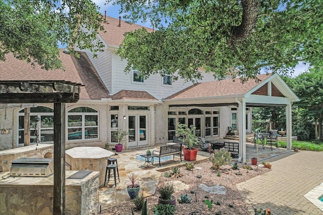 1208 Verdant Way, Austin, TX 78746 - rear view of house with french doors, a patio, and roof with shingles