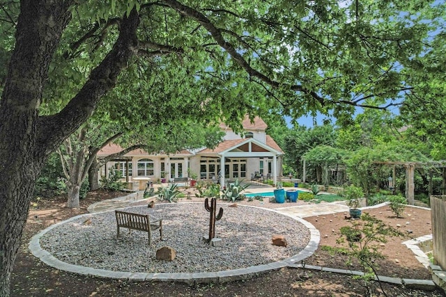 1208 Verdant Way, Austin, TX 78746 - back of house featuring a patio area
