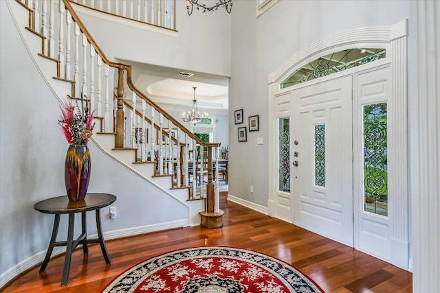 1208 Verdant Way, Austin, TX 78746 - entrance foyer featuring a chandelier, wood finished floors, and stairs
