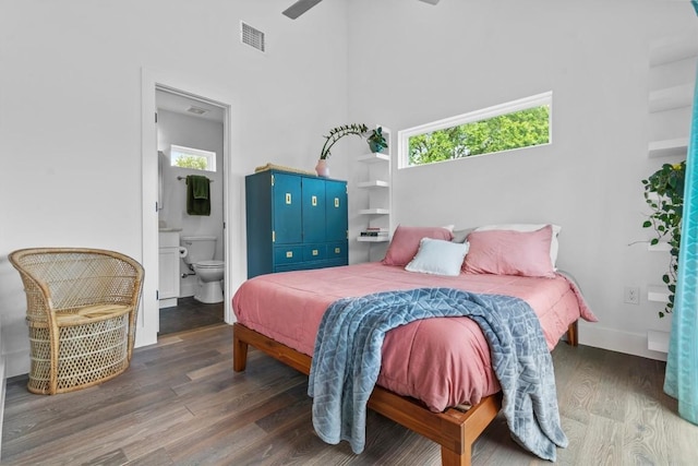 5006 Lott Ave Unit 2, Austin, TX 78721 - bedroom featuring wood finished floors, a high ceiling, and connected bathroom