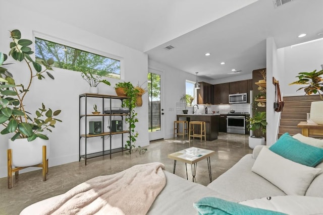 5006 Lott Ave Unit 2, Austin, TX 78721 - living room featuring recessed lighting and baseboards