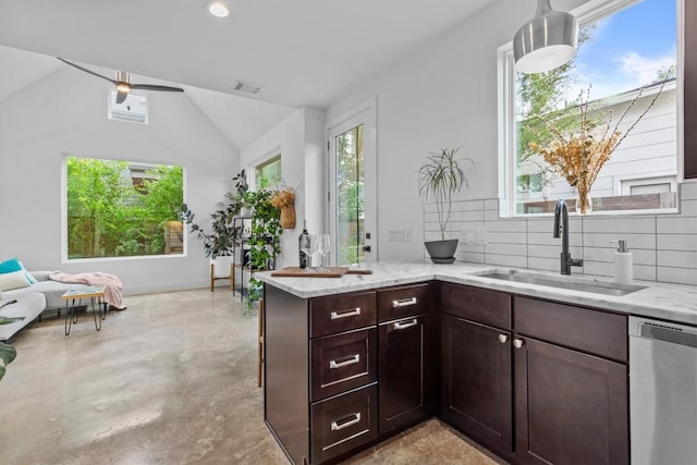 5006 Lott Ave Unit 2, Austin, TX 78721 - kitchen featuring stainless steel dishwasher, tasteful backsplash, light stone counters, vaulted ceiling, and open floor plan