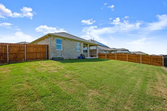 649 Otto Ave, Georgetown, TX 78626 - rear view of house with a fenced backyard and brick siding