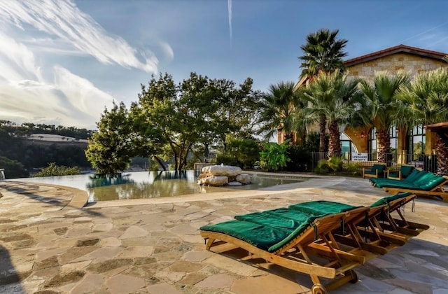 963 Tomichi Trl, Lakeway, TX 78738 - view of home's community featuring a patio area