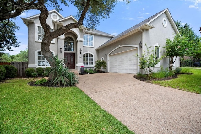 10908 Sans Souci Pl, Austin, TX 78759 - traditional home featuring stucco siding, concrete driveway, and an attached garage