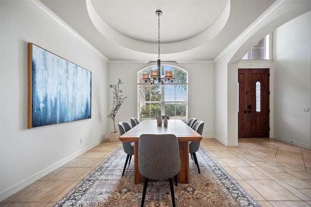 10908 Sans Souci Pl, Austin, TX 78759 - dining room featuring a tray ceiling, a chandelier, light tile patterned flooring, and crown molding