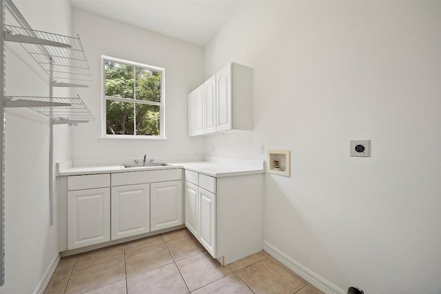 10908 Sans Souci Pl, Austin, TX 78759 - laundry room featuring hookup for a washing machine, hookup for an electric dryer, light tile patterned floors, and cabinet space