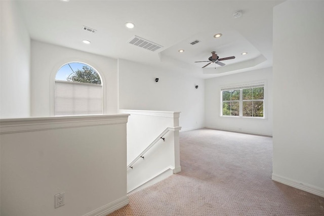 10908 Sans Souci Pl, Austin, TX 78759 - empty room featuring recessed lighting, carpet floors, a smoke detector, ceiling fan, and a tray ceiling