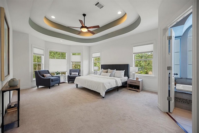 10908 Sans Souci Pl, Austin, TX 78759 - carpeted bedroom featuring recessed lighting, a raised ceiling, and ceiling fan