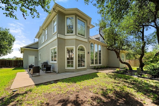 10908 Sans Souci Pl, Austin, TX 78759 - back of house with stucco siding and a patio area