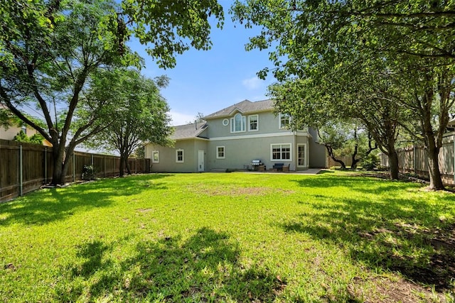 10908 Sans Souci Pl, Austin, TX 78759 - rear view of property featuring stucco siding, a fenced backyard, and a patio