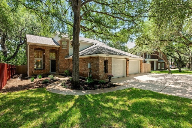 11305 Deputy Dr, Austin, TX 78748 - view of front of property featuring brick siding, a garage, concrete driveway, and a shingled roof