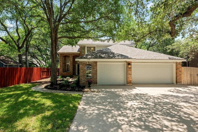 11305 Deputy Dr, Austin, TX 78748 - view of front of house featuring a garage, driveway, roof with shingles, and brick siding