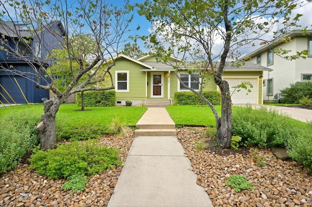 6102 Laird Dr, Austin, TX 78757 - view of front facade featuring a garage, driveway, and a front lawn