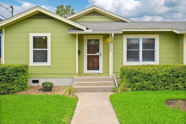 6102 Laird Dr, Austin, TX 78757 - bungalow featuring a front lawn and a shingled roof