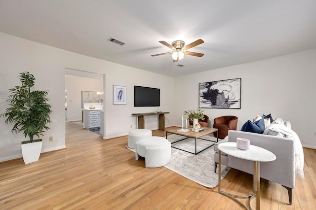 6102 Laird Dr, Austin, TX 78757 - living area featuring a ceiling fan and light wood-type flooring