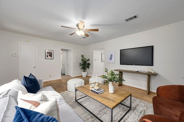 6102 Laird Dr, Austin, TX 78757 - living room featuring ceiling fan and wood finished floors