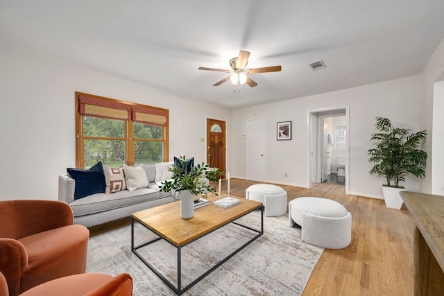 6102 Laird Dr, Austin, TX 78757 - living area with a ceiling fan and light wood-type flooring