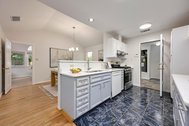 6102 Laird Dr, Austin, TX 78757 - kitchen featuring gas stove, under cabinet range hood, white dishwasher, plenty of natural light, and lofted ceiling