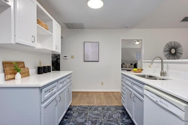 6102 Laird Dr, Austin, TX 78757 - kitchen featuring white dishwasher, open shelves, light countertops, and a ceiling fan