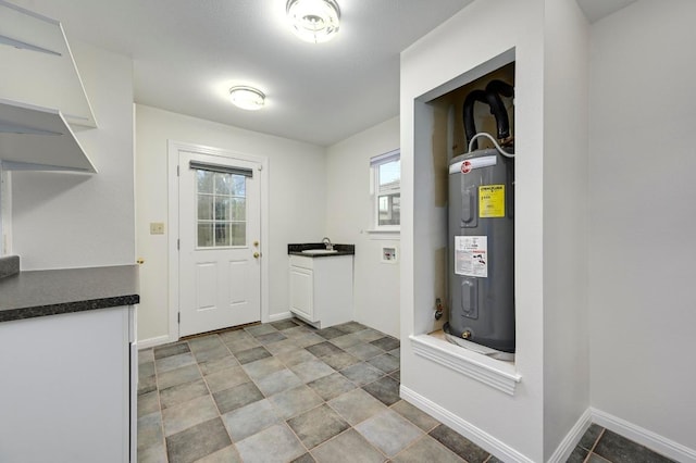 6102 Laird Dr, Austin, TX 78757 - laundry area featuring water heater and washer hookup