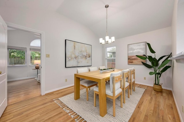 6102 Laird Dr, Austin, TX 78757 - dining space with a chandelier, light wood-style floors, and vaulted ceiling