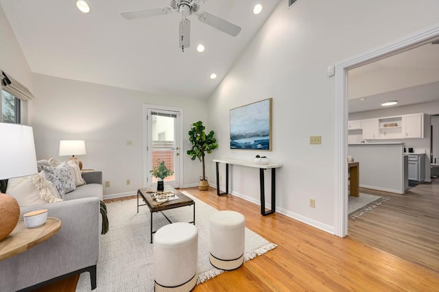 6102 Laird Dr, Austin, TX 78757 - living room featuring light wood finished floors, recessed lighting, a ceiling fan, and high vaulted ceiling