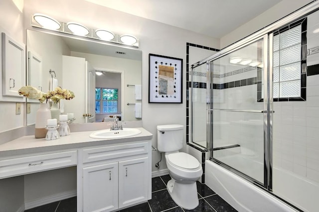 6102 Laird Dr, Austin, TX 78757 - bathroom featuring vanity, combined bath / shower with glass door, and tile patterned flooring
